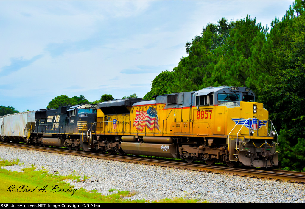 A WB Grain Train Patiently Awaits the Clearing of a Wreck Ahead